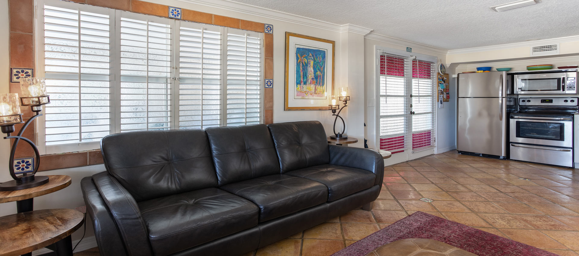 Jamaica Livingroom with beautiful couch looking into the kitchen