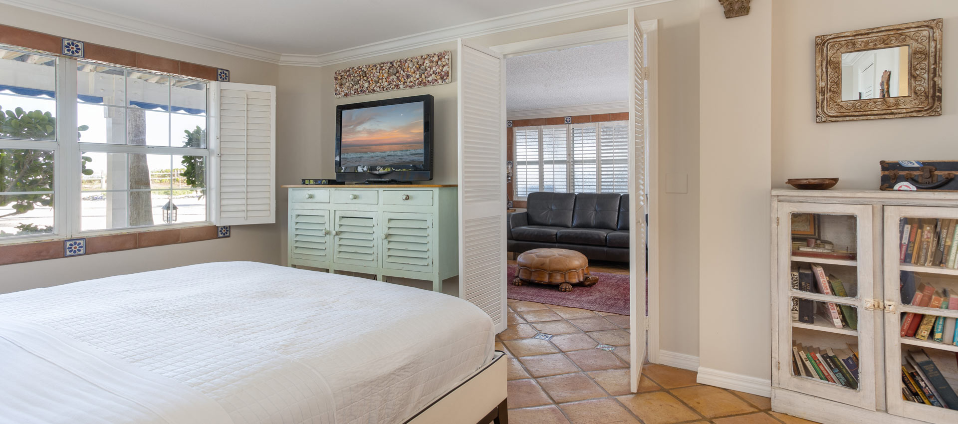 Jamaica bed room looking into the living room with view of the ocean