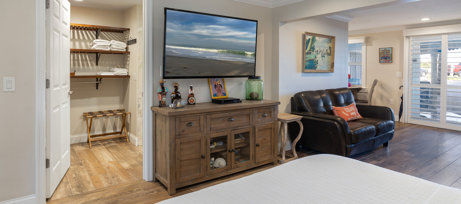 Bahama Suite  looking from the bed with love seat and TV