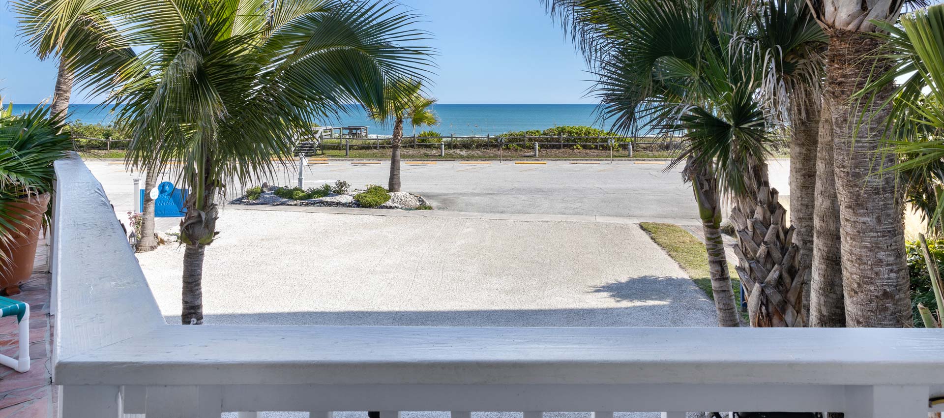 Cayman Suite deck looking out to the beach and ocean